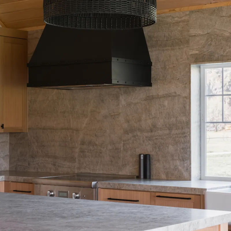 Full-height stone backsplash